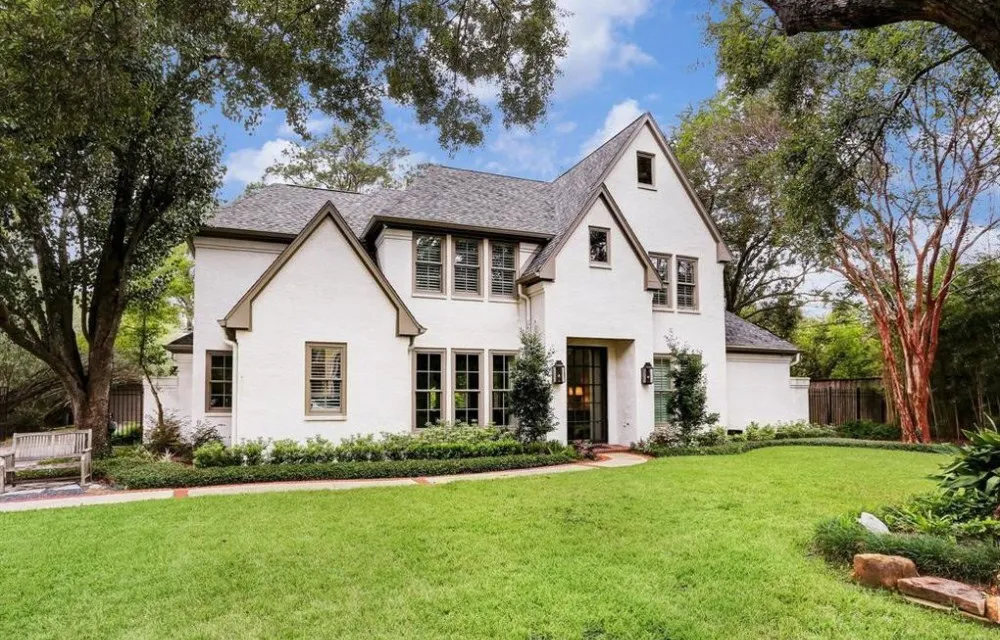 Piney Point home with a soft stucco-like slurry over brick