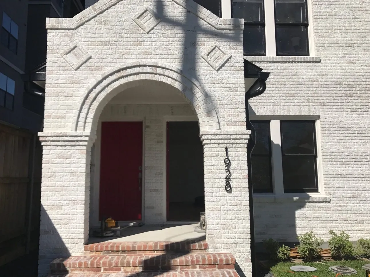Whole-home decorative limewash on brick, front view
